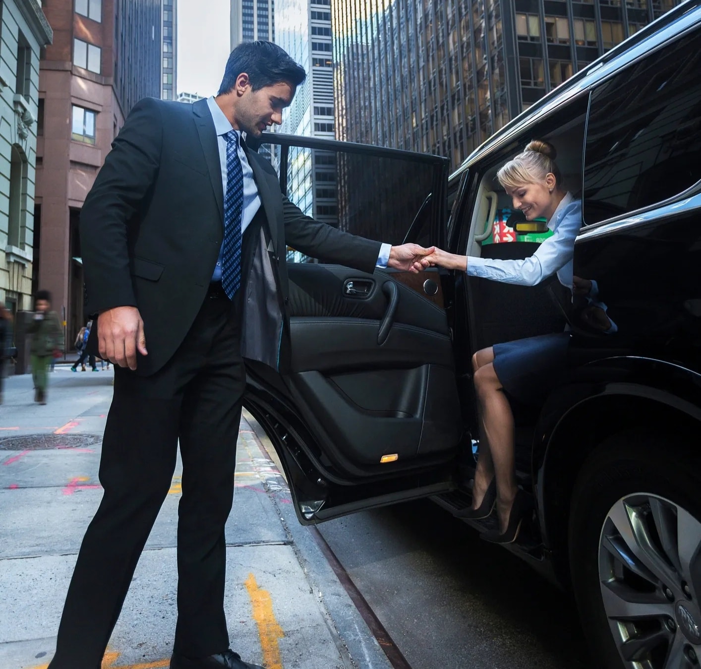 Gloved chauffeur hand opening car door